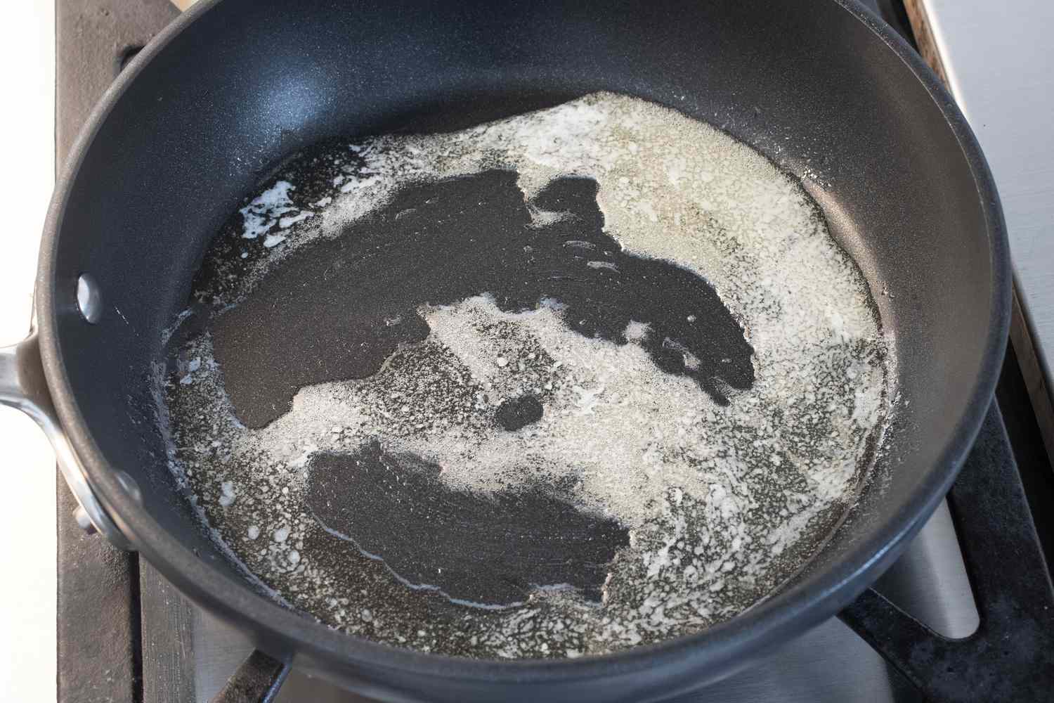 Butter being melted in a nonstick skillet
