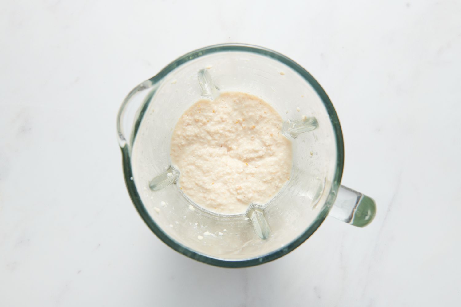 A blender pitcher with pureed urad dal-fenugreek batter