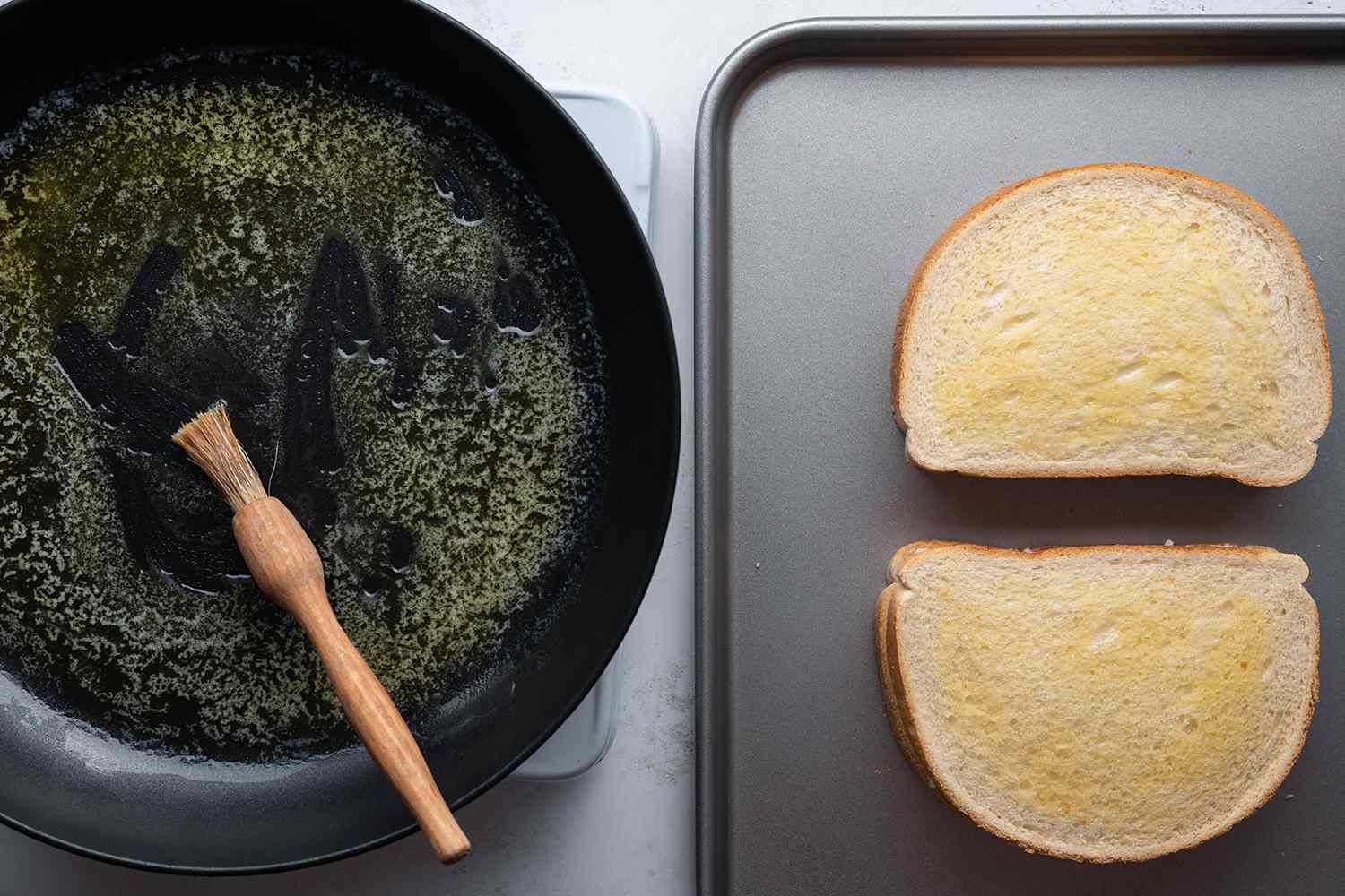 Butter in a pan with a brush