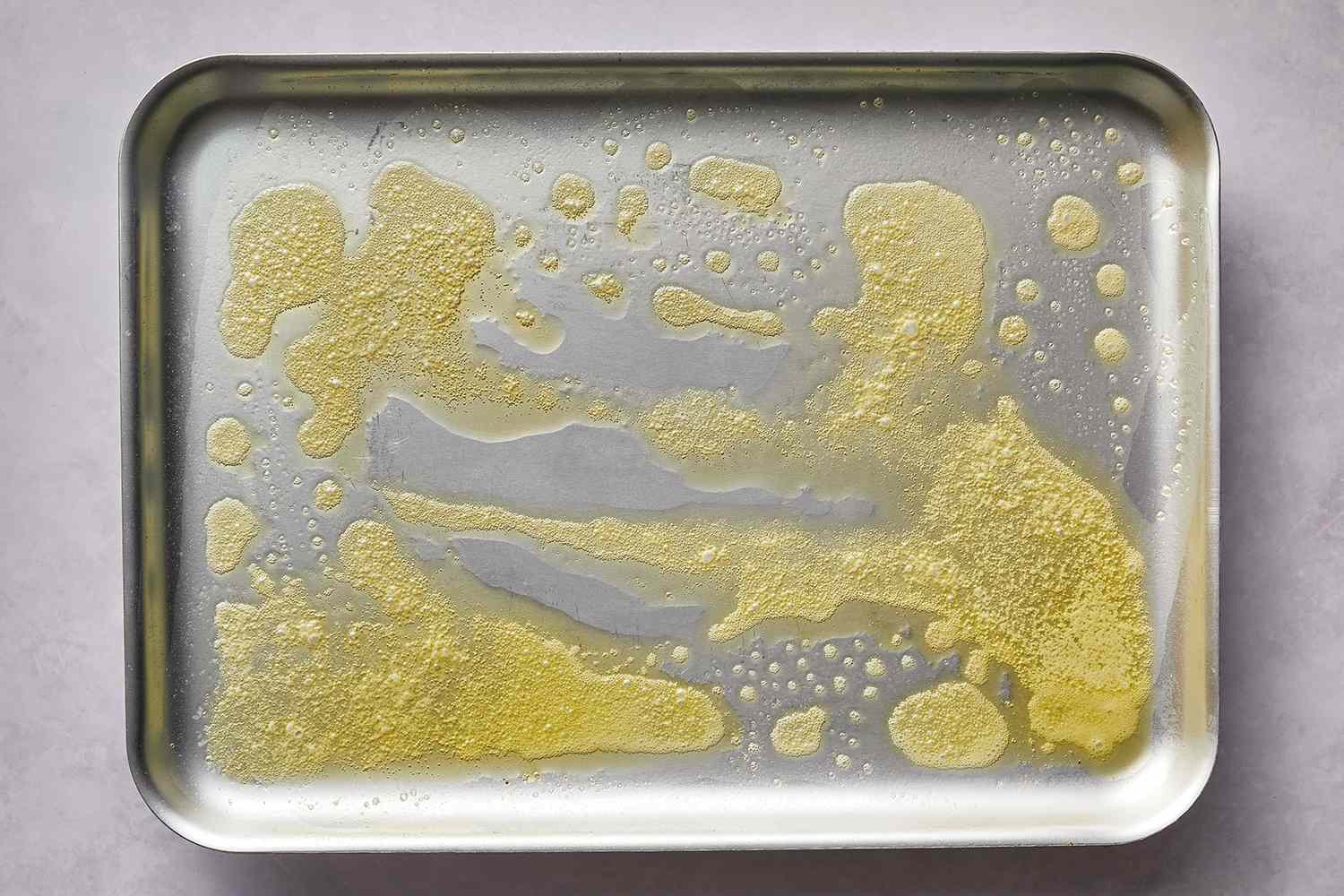 Melted butter in a sheet pan