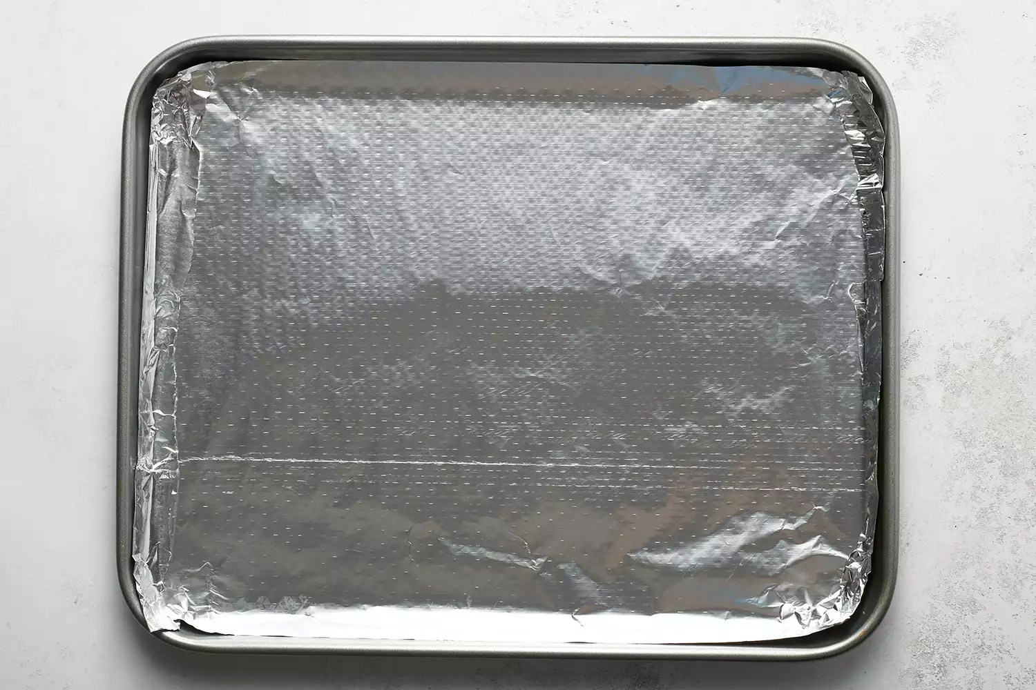 assadeira forrada com papel alumínio